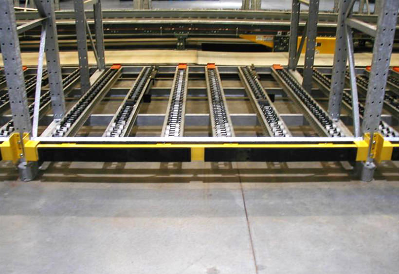 Pallet rack protection bumpers with leaf springs